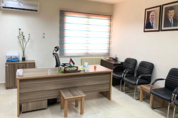 A desk and chairs in a health center in amman, jordan.