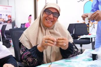 A business owner in ajloun refines her packaging practices through hands-on training to prepare for new market opportunities.