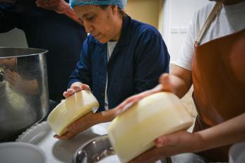 Kholoud Hourani, one of the eight remarkable women at FormaJO social enterprise, turns her dreams into reality as she crafts delectable cheese.(Photo by Habibi Association)