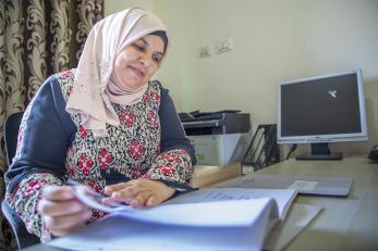 A person reviewing paperwork.