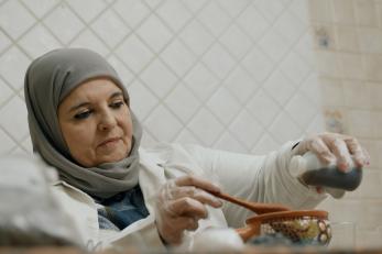 A Jordanian biologist mixes ingredients for natural cosmetics products.