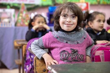 Summayya, a 6-year-old student with Down syndrome, receives one-on-one support from a Mercy Corps-trained assistant teacher, giving her the opportunity to learn alongside her peers.