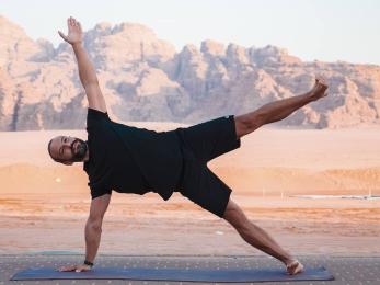 A person performing a yoga stance.