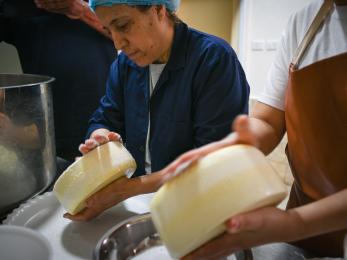Kholoud Hourani, one of the eight remarkable women at FormaJO social enterprise, turns her dreams into reality as she crafts delectable cheese.(Photo by Habibi Association)