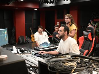 A group of creatives work in a sound studio in jordan.