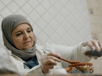 A Jordanian biologist mixes ingredients for natural cosmetics products.