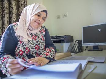 A person reviewing paperwork.