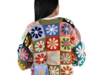 Jordanian woman, with her back to camera, modelling a knit sweater.